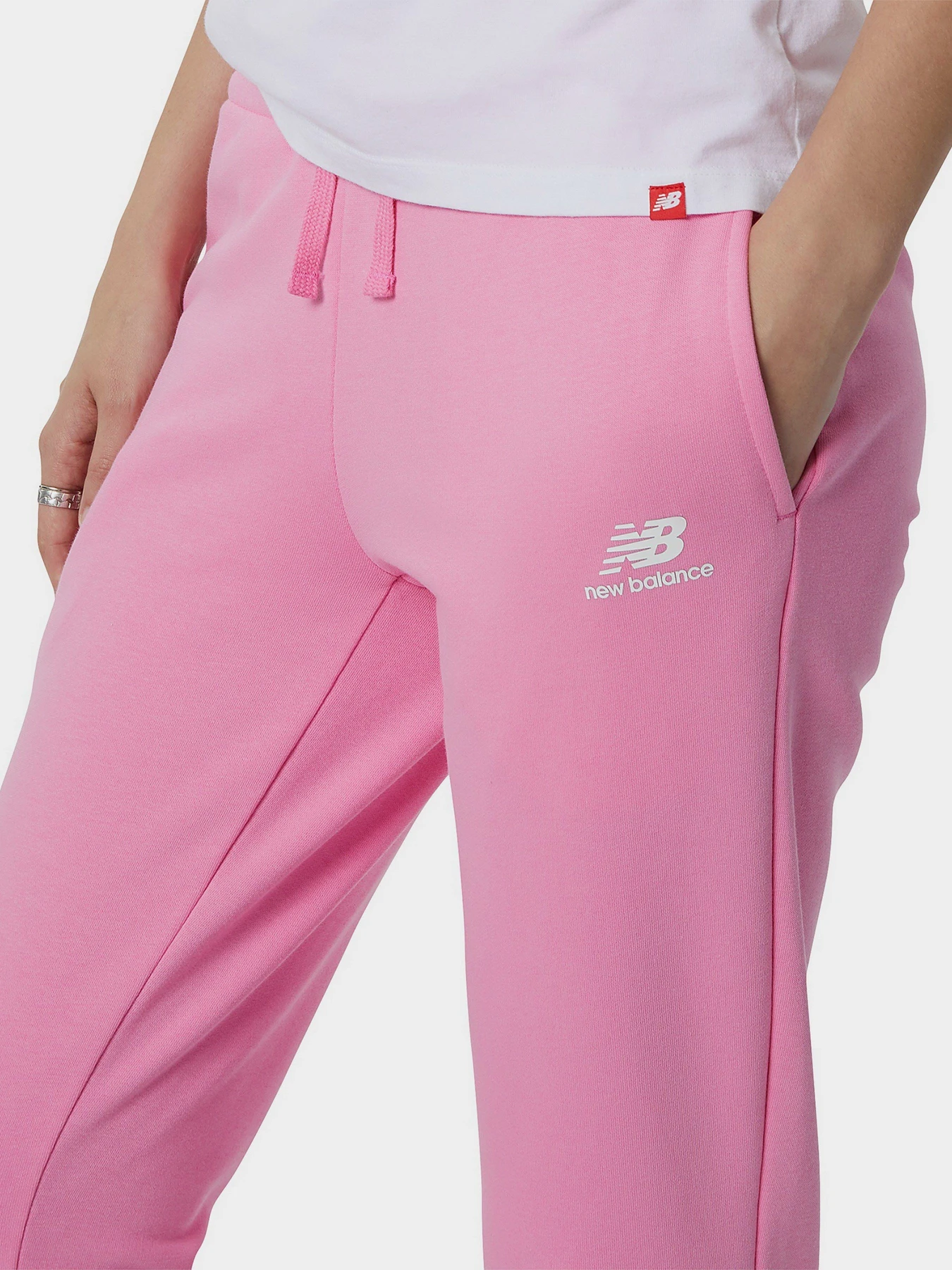 Брюки New Balance Essentials Celebrate Fleece модель WP21508VPK Брюки New Balance Essentials Celebrate Fleece модель WP21508VPK Фото