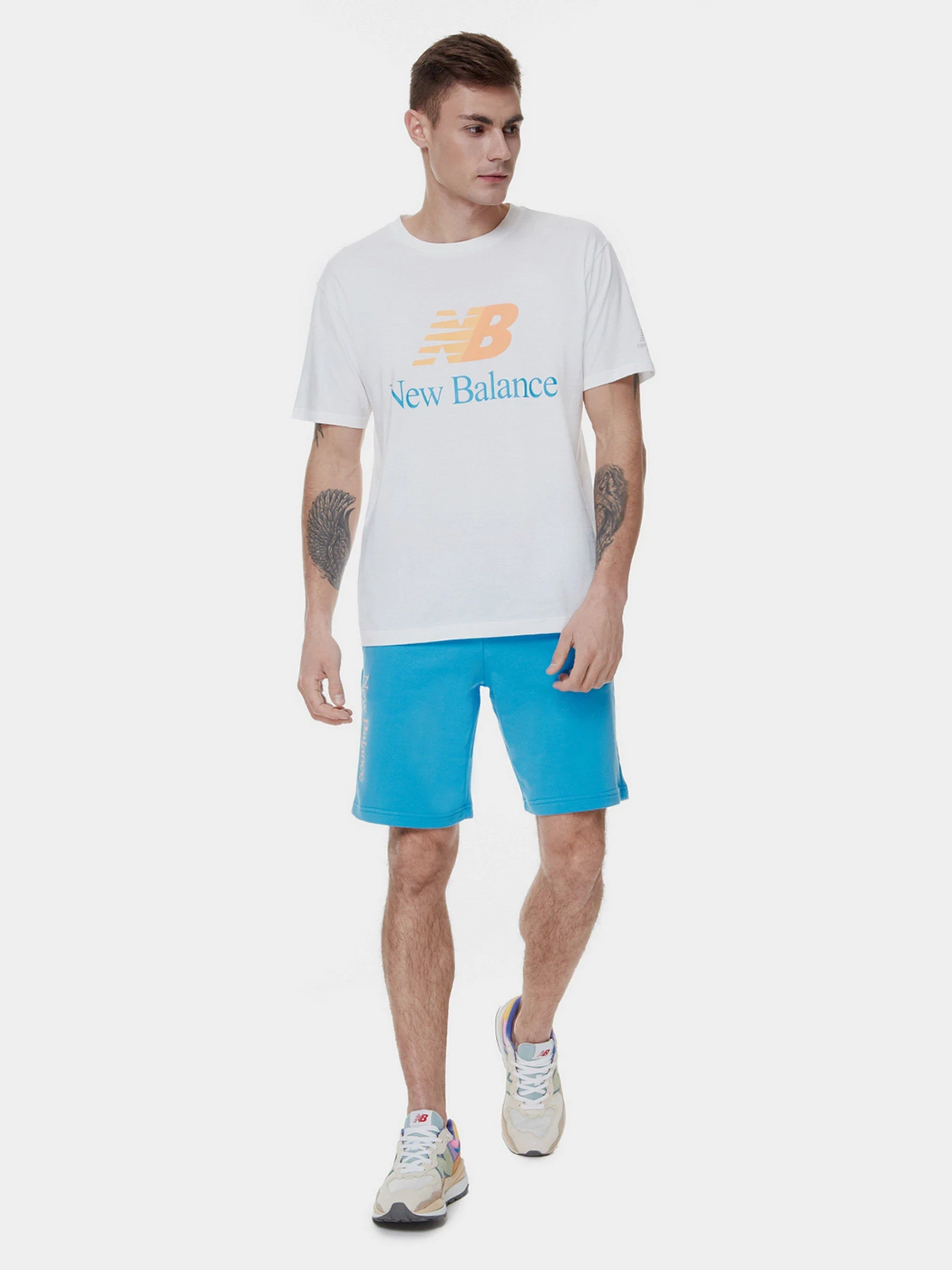 Футболки и поло New Balance Essentials Celebrate модель MT21529WT Футболки и поло New Balance Essentials Celebrate модель MT21529WT Фото