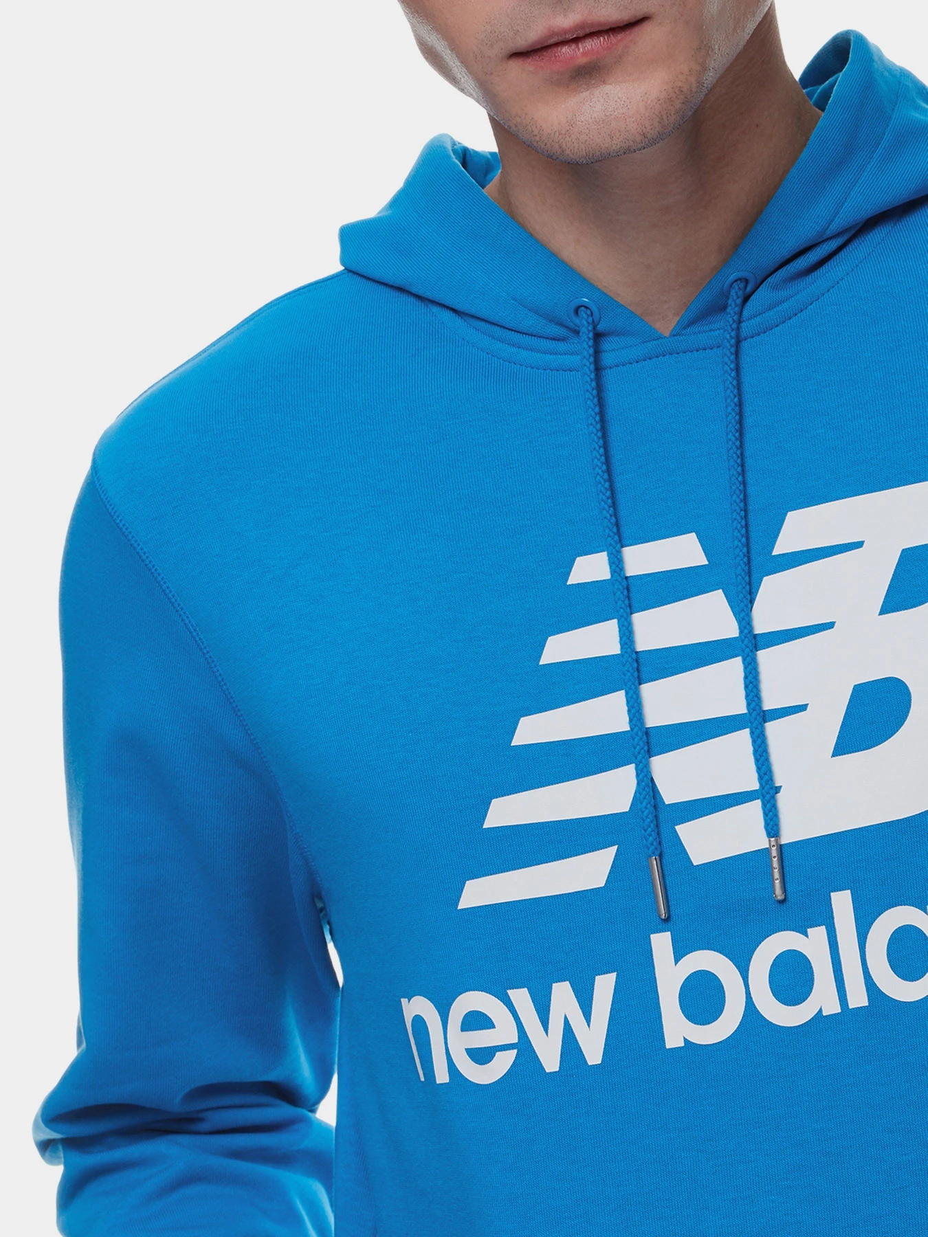 Худі та світшоти New Balance NB Essentials Stacked Logo модель MT03558SBU Худі та світшоти New Balance NB Essentials Stacked Logo модель MT03558SBU Фото