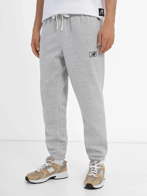 Штани New Balance Essentials Brushed Back модель MP33521AG Фото
