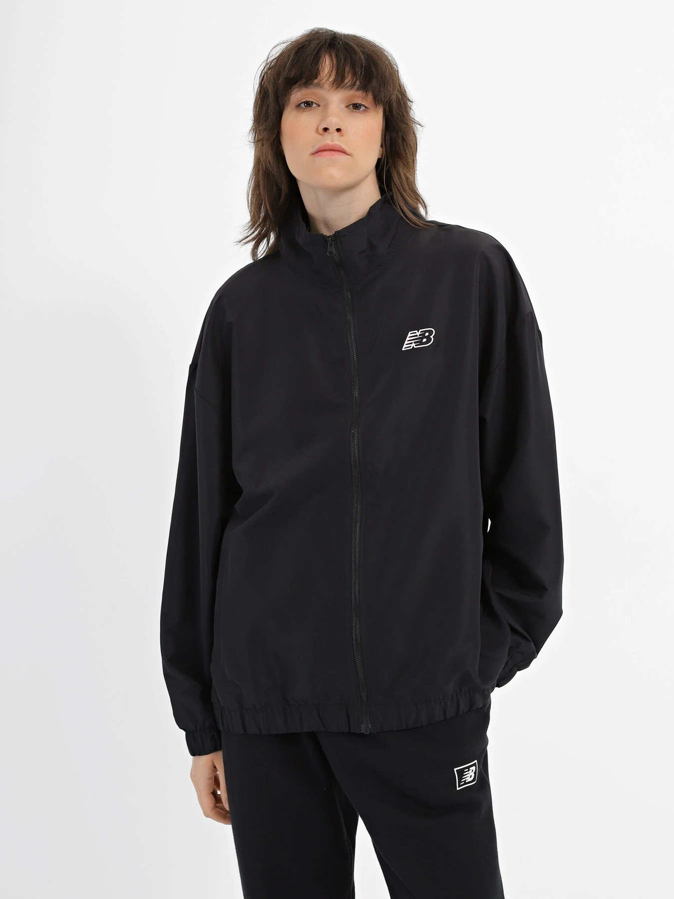 Куртки та дублянки New Balance Sport Woven модель WJ33501BK Куртки та дублянки New Balance Sport Woven модель WJ33501BK Фото