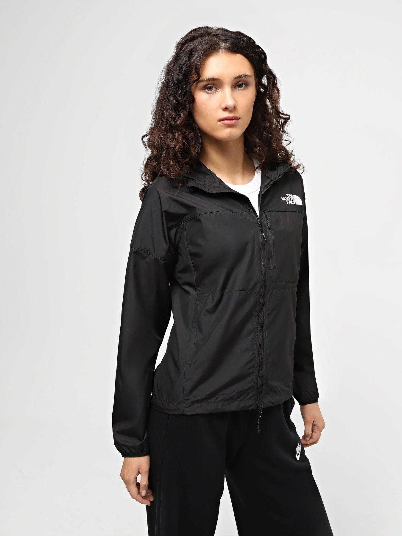 Куртки и дубленки The North Face W Higher Run Wind Jacket модель NF0A8720JK31 Фото