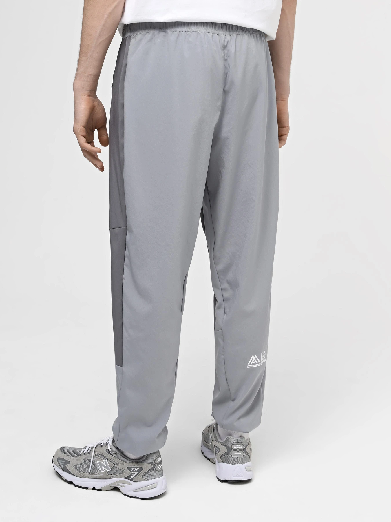 Брюки The North Face M Ma Wind Track Pant модель NF0A87J6W2O1 Брюки The North Face M Ma Wind Track Pant модель NF0A87J6W2O1 Фото