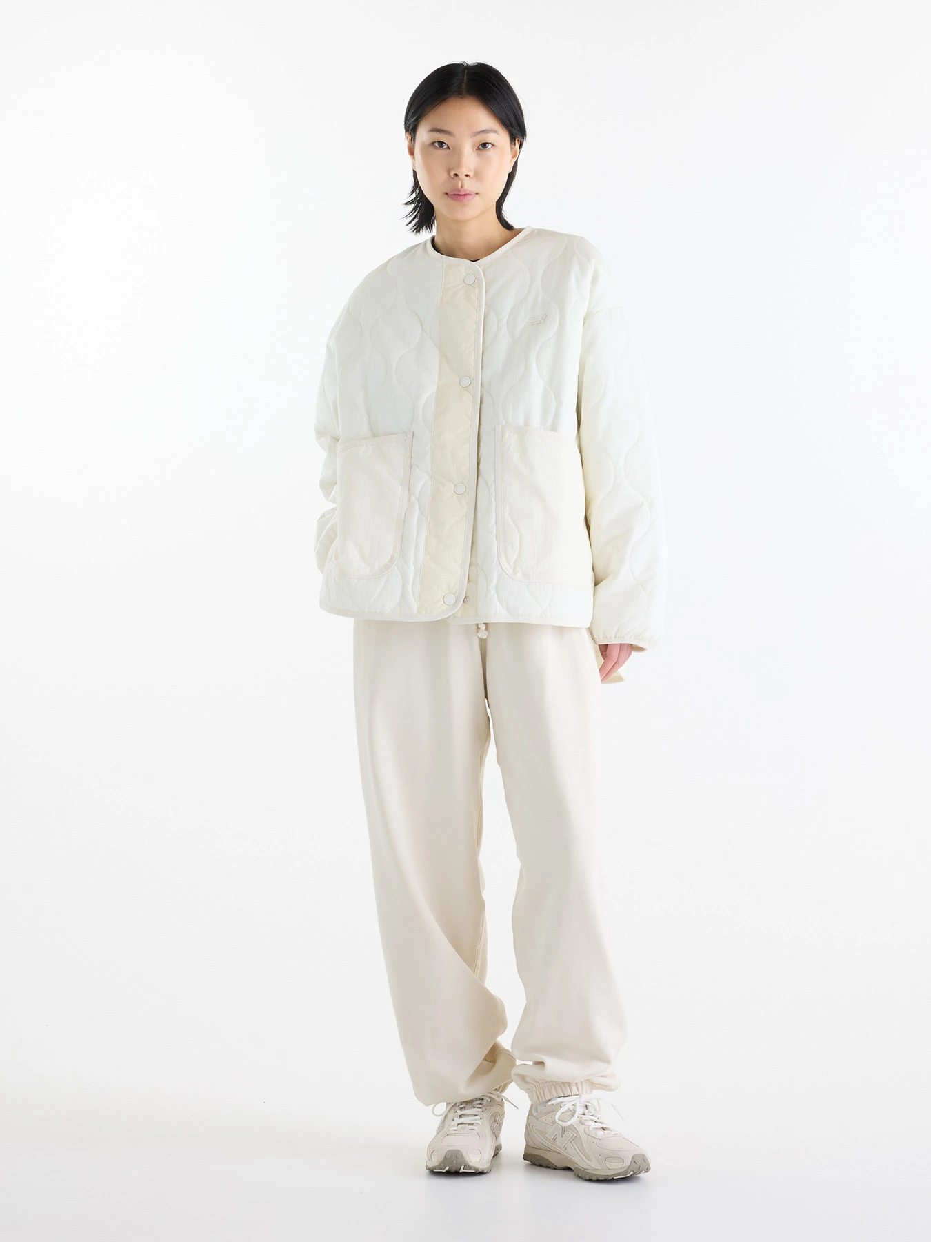 Куртки та дублянки New Balance Quilted Bomber модель WJ62P3VEAGA Фото