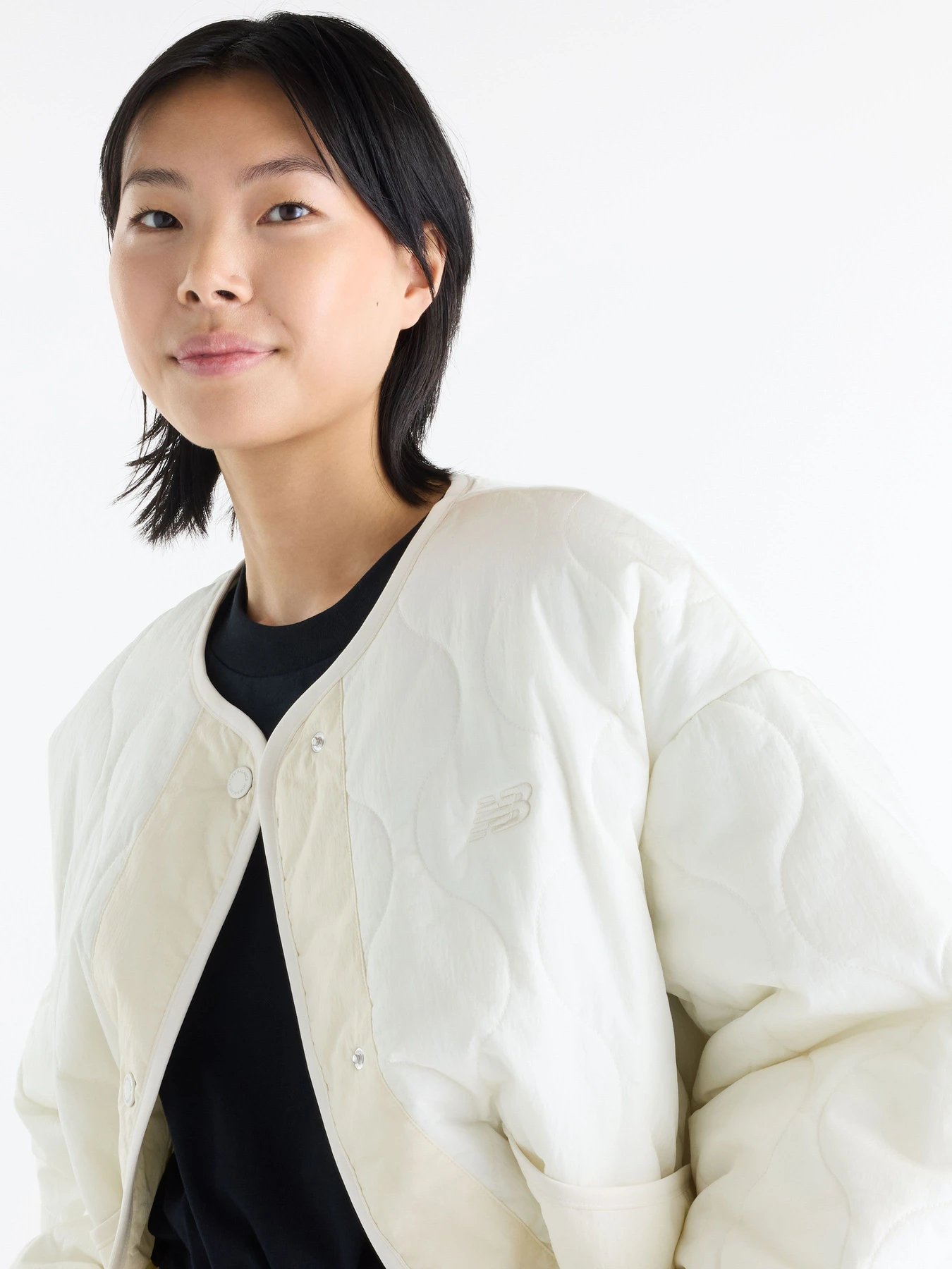 Куртки та дублянки New Balance Quilted Bomber модель WJ62P3VEAGA Фото