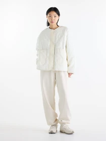Куртки та дублянки New Balance Quilted Bomber модель WJ62P3VEAGA Фото