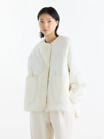 Куртки та дублянки New Balance Quilted Bomber модель WJ62P3VEAGA Фото