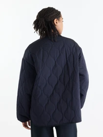 Куртки та дублянки New Balance Quilted Bomber модель WJ62P3VEDNT Фото