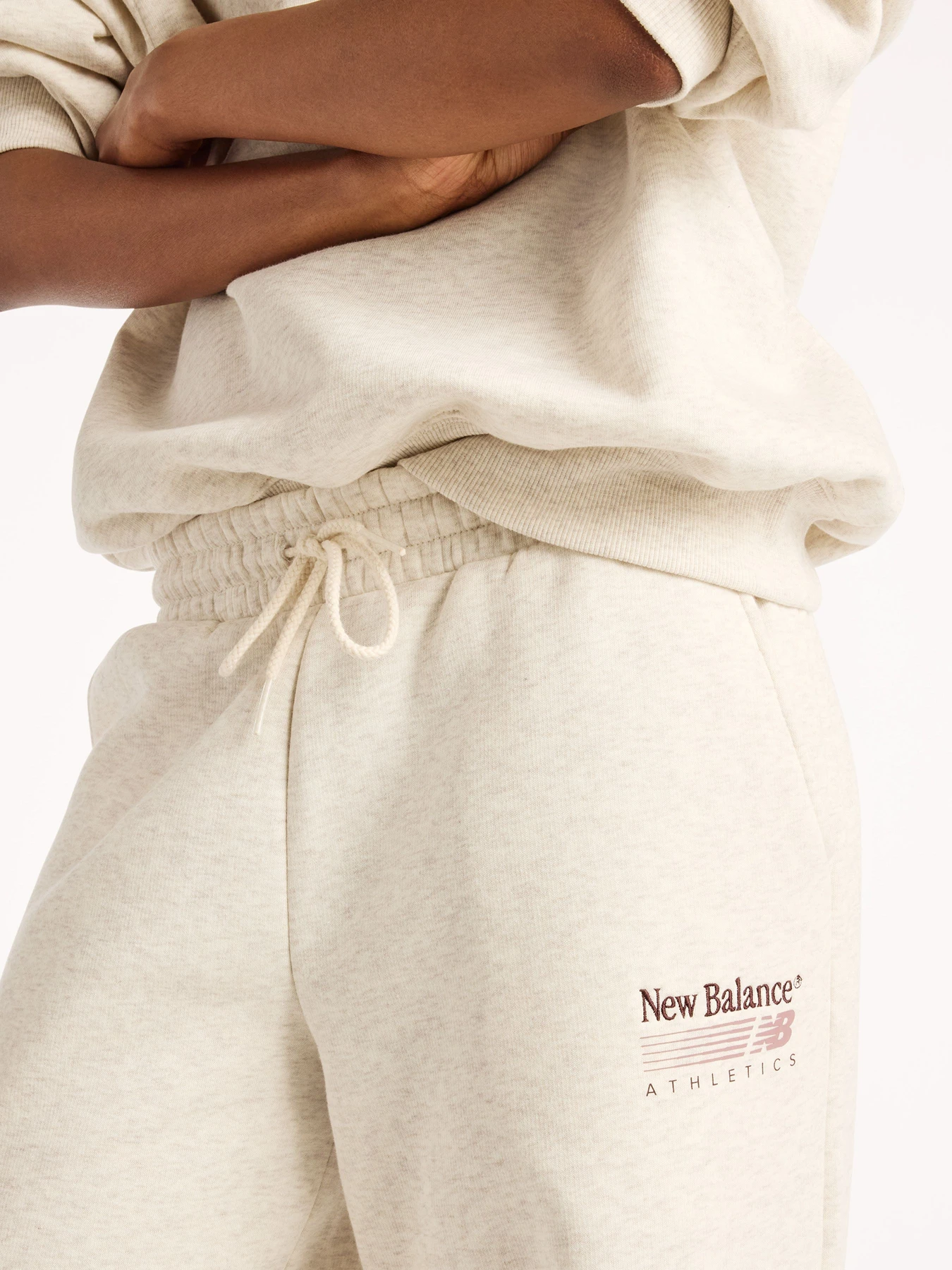 Штани New Balance Trackside Fleece модель WB62983ALIT Фото