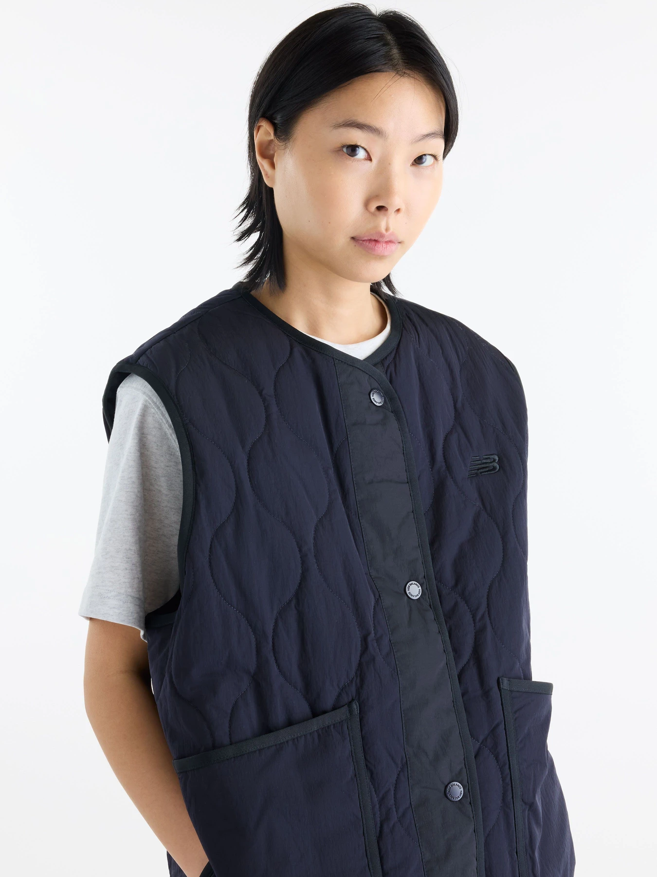 Куртки и дубленки New Balance Quilted Vest модель WJ62U33ODNT Куртки и дубленки New Balance Quilted Vest модель WJ62U33ODNT Фото
