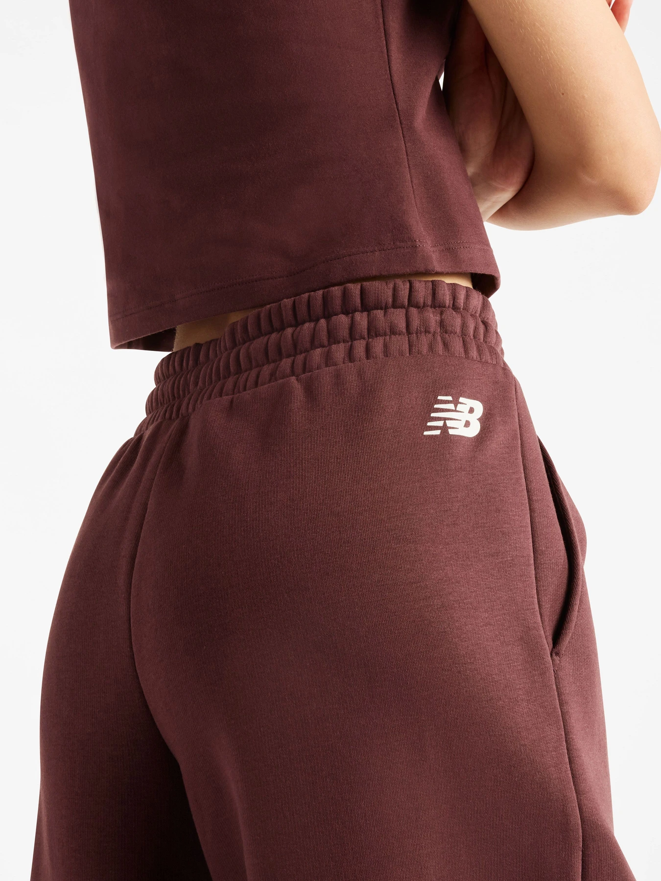 Брюки New Balance Trackside Fleece модель WB62983AYLR Брюки New Balance Trackside Fleece модель WB62983AYLR Фото