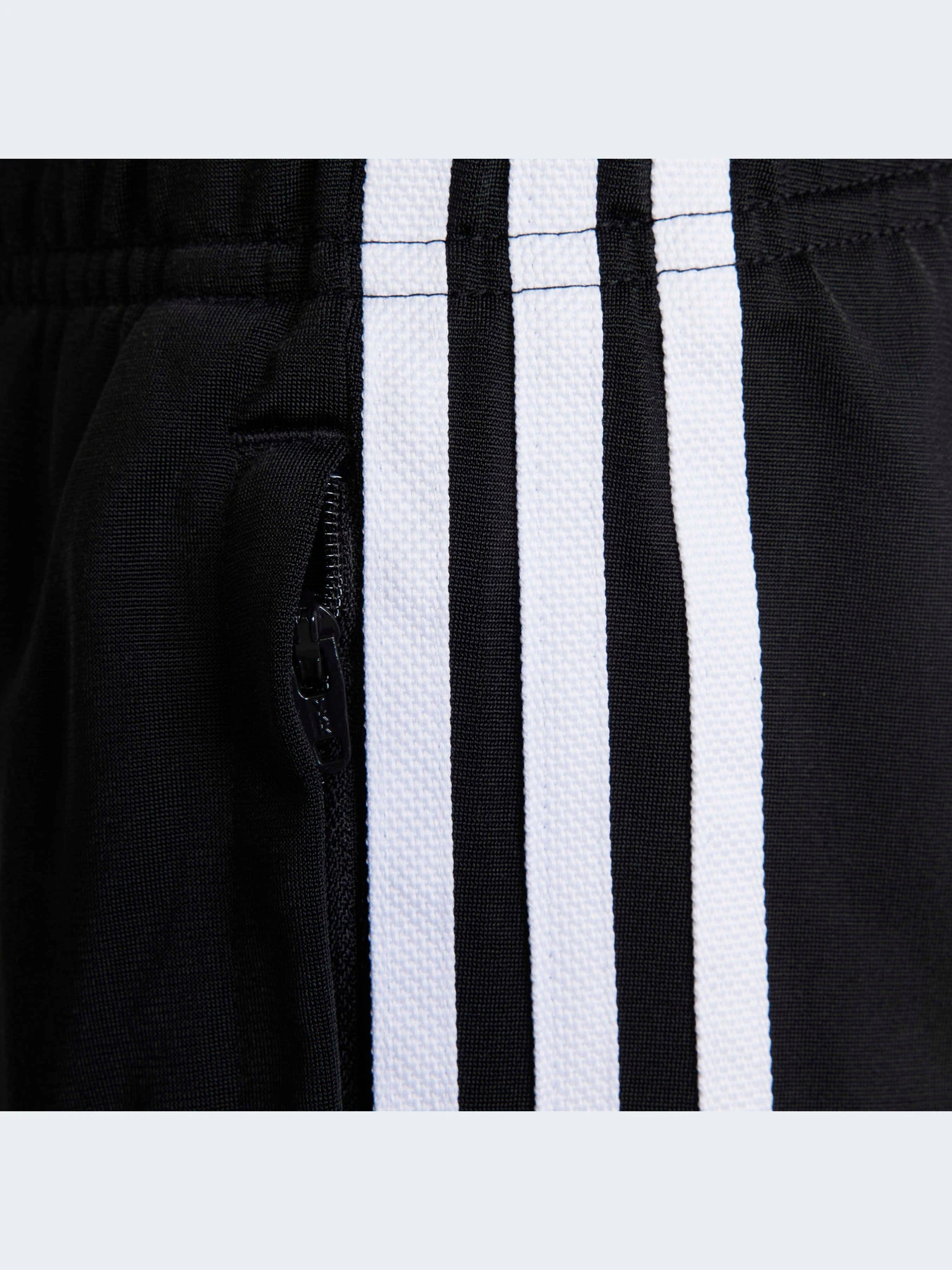 Брюки Adidas Adicolor модель HK0347 Брюки Adidas Adicolor модель HK0347 Фото