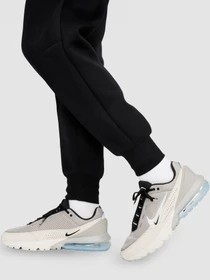 Брюки NIKE W Nsw Tch Flc Mr Jggr модель FB8330-010 Фото