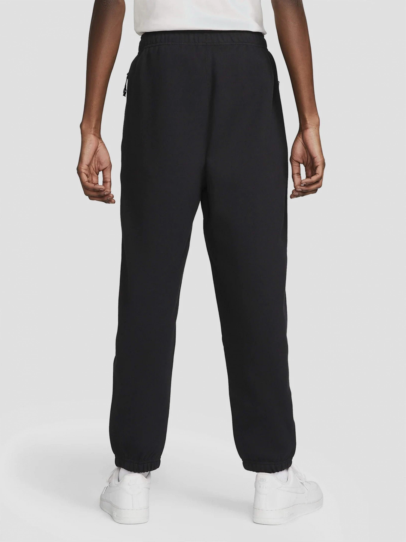 Брюки NIKE Solo Swoosh Fleece Joggers модель DX1364-010 Брюки NIKE Solo Swoosh Fleece Joggers модель DX1364-010 Фото