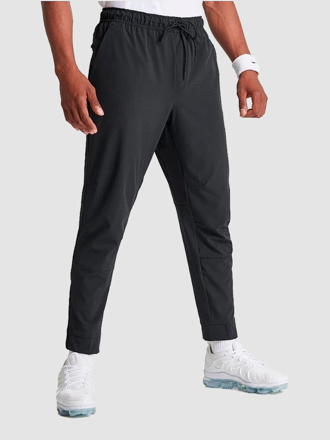 Штани NIKE Dri-Fit Unlimited Tapered Leg модель FB7548-010 Штани NIKE Dri-Fit Unlimited Tapered Leg модель FB7548-010 Фото