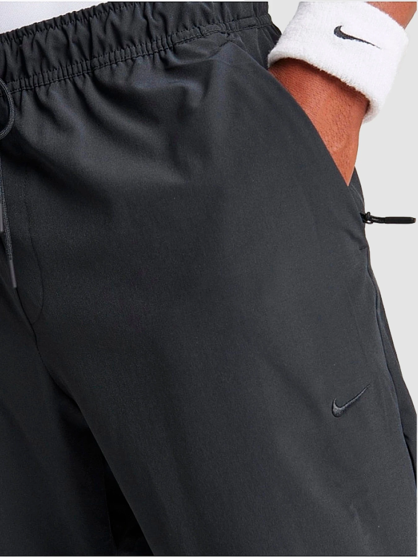 Штани NIKE Dri-Fit Unlimited Tapered Leg модель FB7548-010 Штани NIKE Dri-Fit Unlimited Tapered Leg модель FB7548-010 Фото