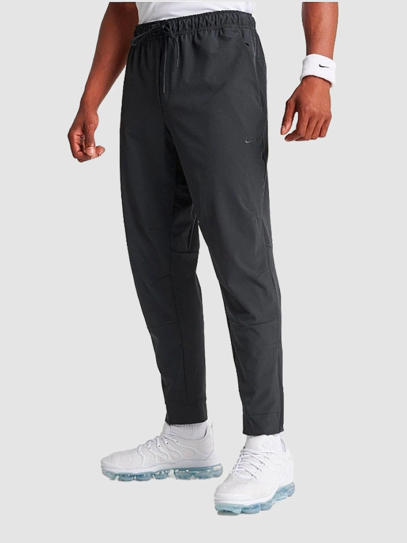 Штани NIKE Dri-Fit Unlimited Tapered Leg модель FB7548-010 Штани NIKE Dri-Fit Unlimited Tapered Leg модель FB7548-010 Фото