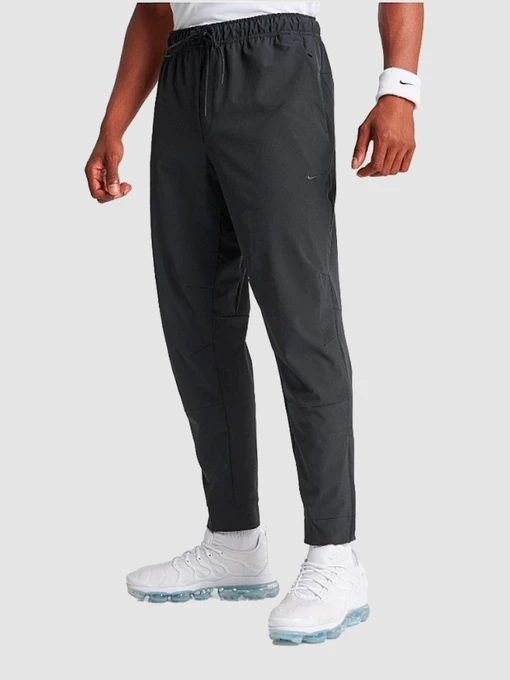 Брюки NIKE Dri-Fit Unlimited Tapered Leg модель FB7548-010 Фото