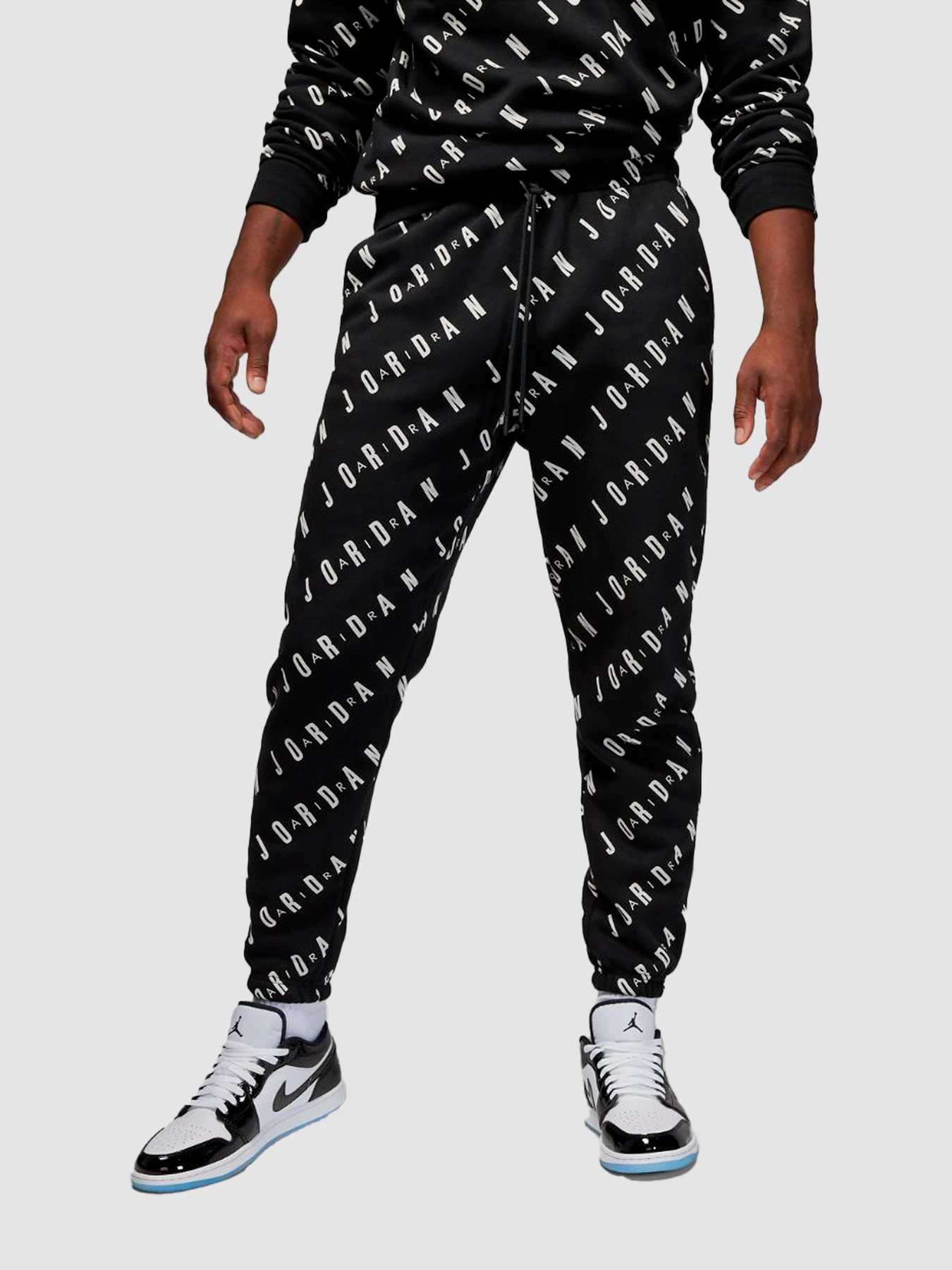 Штани Jordan Aop Graphics Fleece Pants модель DV7646-010 Фото