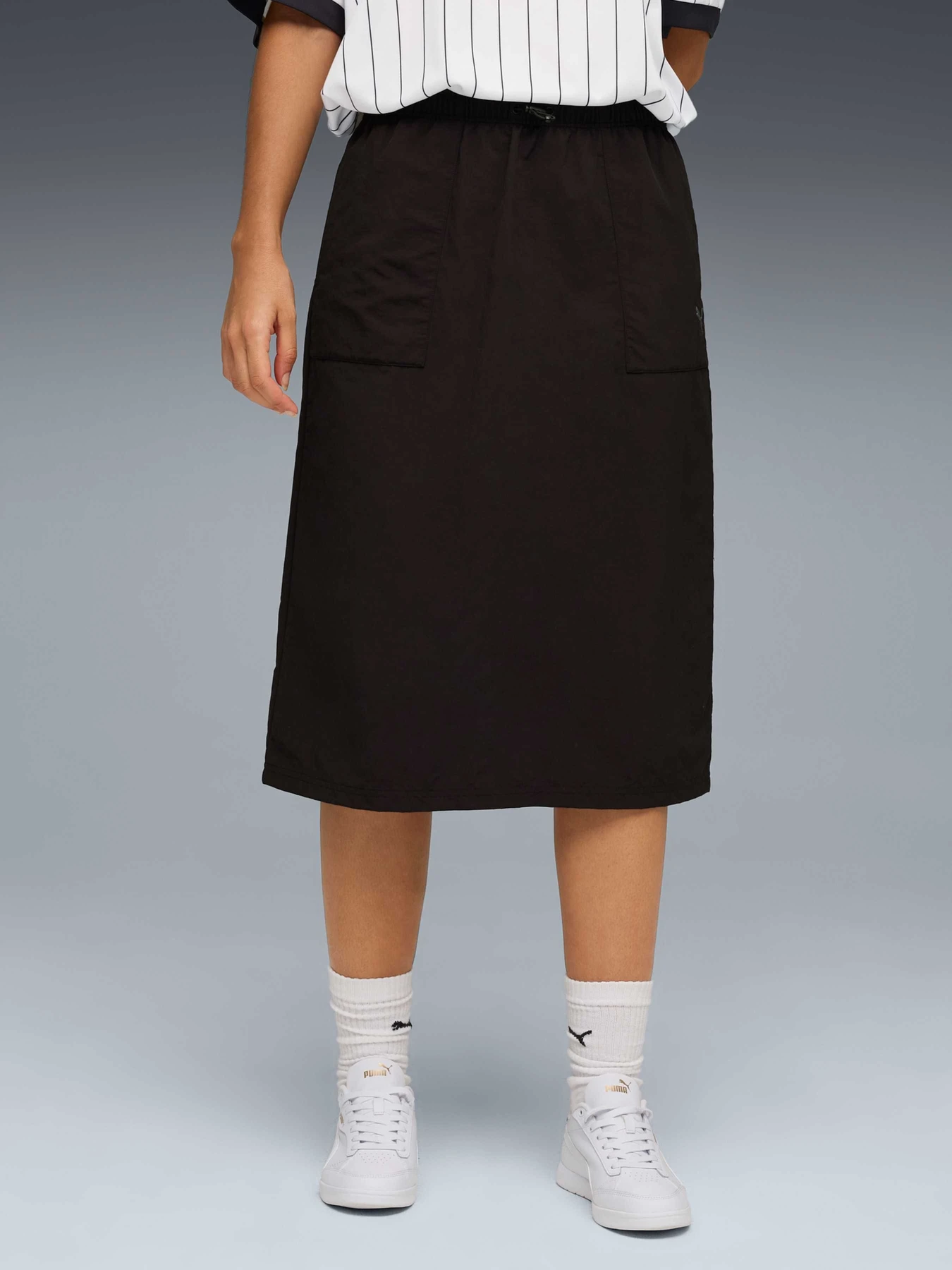 Юбки PUMA Her Woven High-waist Skirt модель 688155 Юбки PUMA Her Woven High-waist Skirt модель 688155 Фото