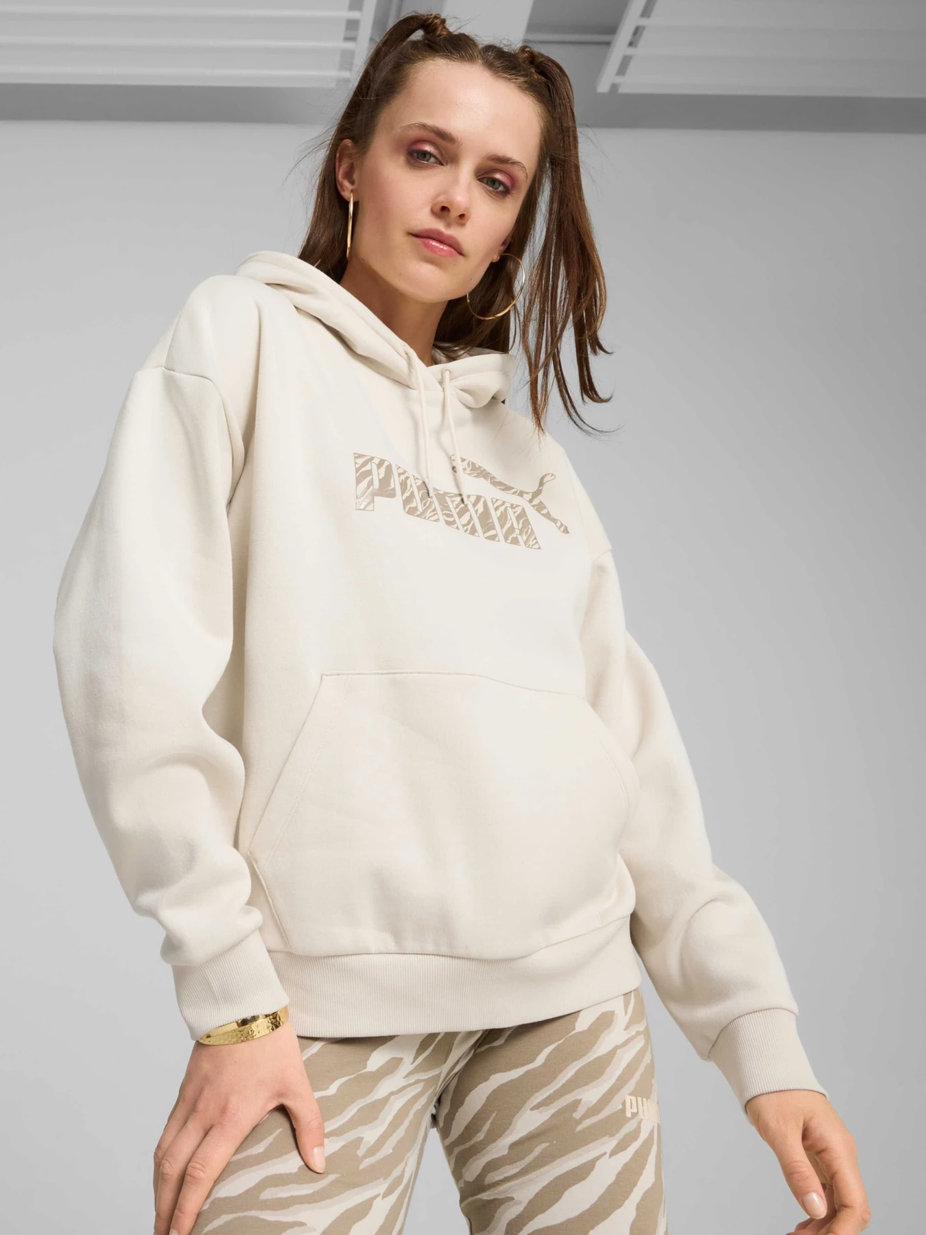 Худі та світшоти PUMA Ess+ Animal Hoodie Fl модель 681492 Фото