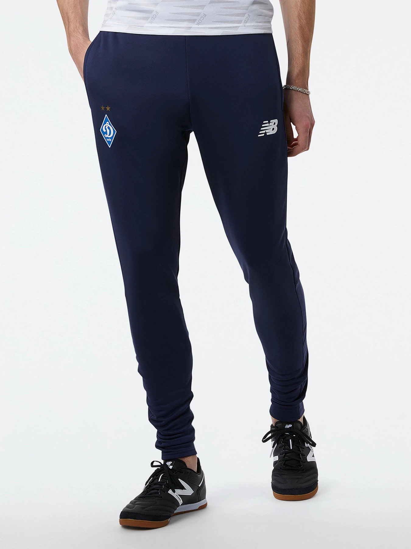 Брюки New Balance модель MP231102NV Брюки New Balance модель MP231102NV Фото