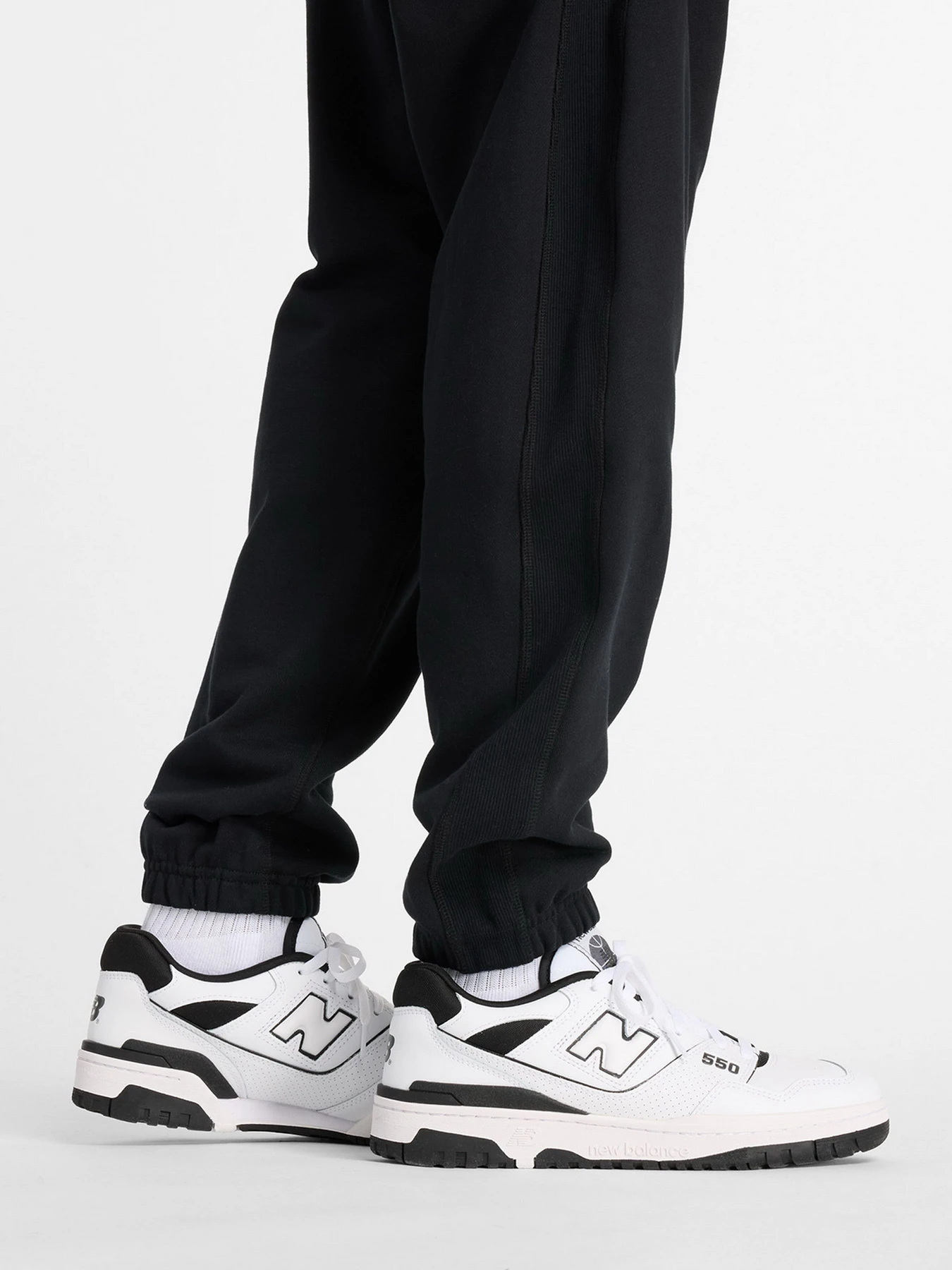 Штани New Balance модель MP41508BK Фото