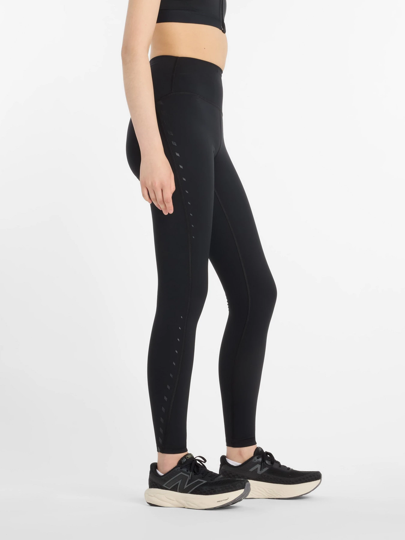 Штани New Balance Athletics Reflective Heat Legging 27" модель WP53258BK Фото