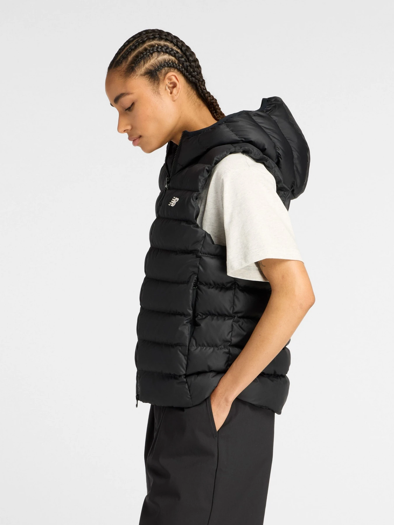 Куртки та дублянки New Balance Puffer Vest модель WO53508BK Фото