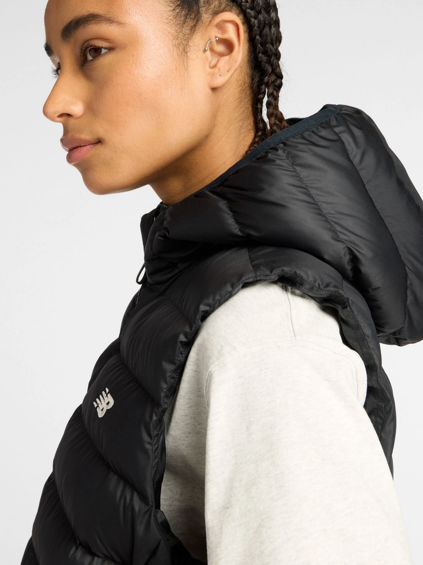 Куртки та дублянки New Balance Puffer Vest модель WO53508BK Фото