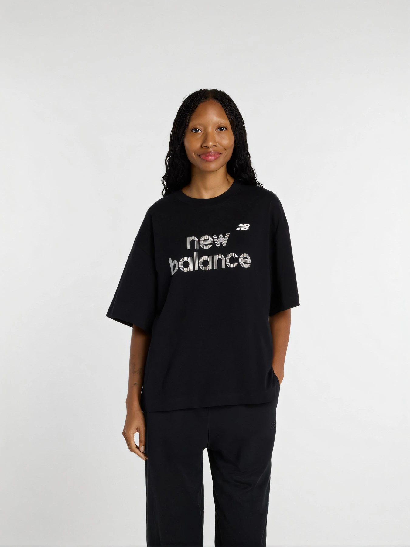 Футболки и поло New Balance модель WT61L713BK Футболки и поло New Balance модель WT61L713BK Фото
