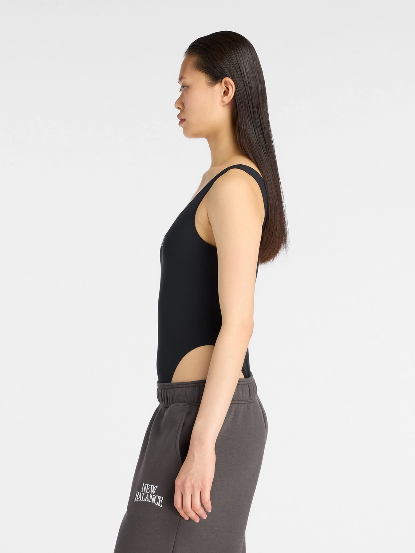 Футболки и поло New Balance Trackside Bodysuit модель WS61T61OBK Футболки и поло New Balance Trackside Bodysuit модель WS61T61OBK Фото