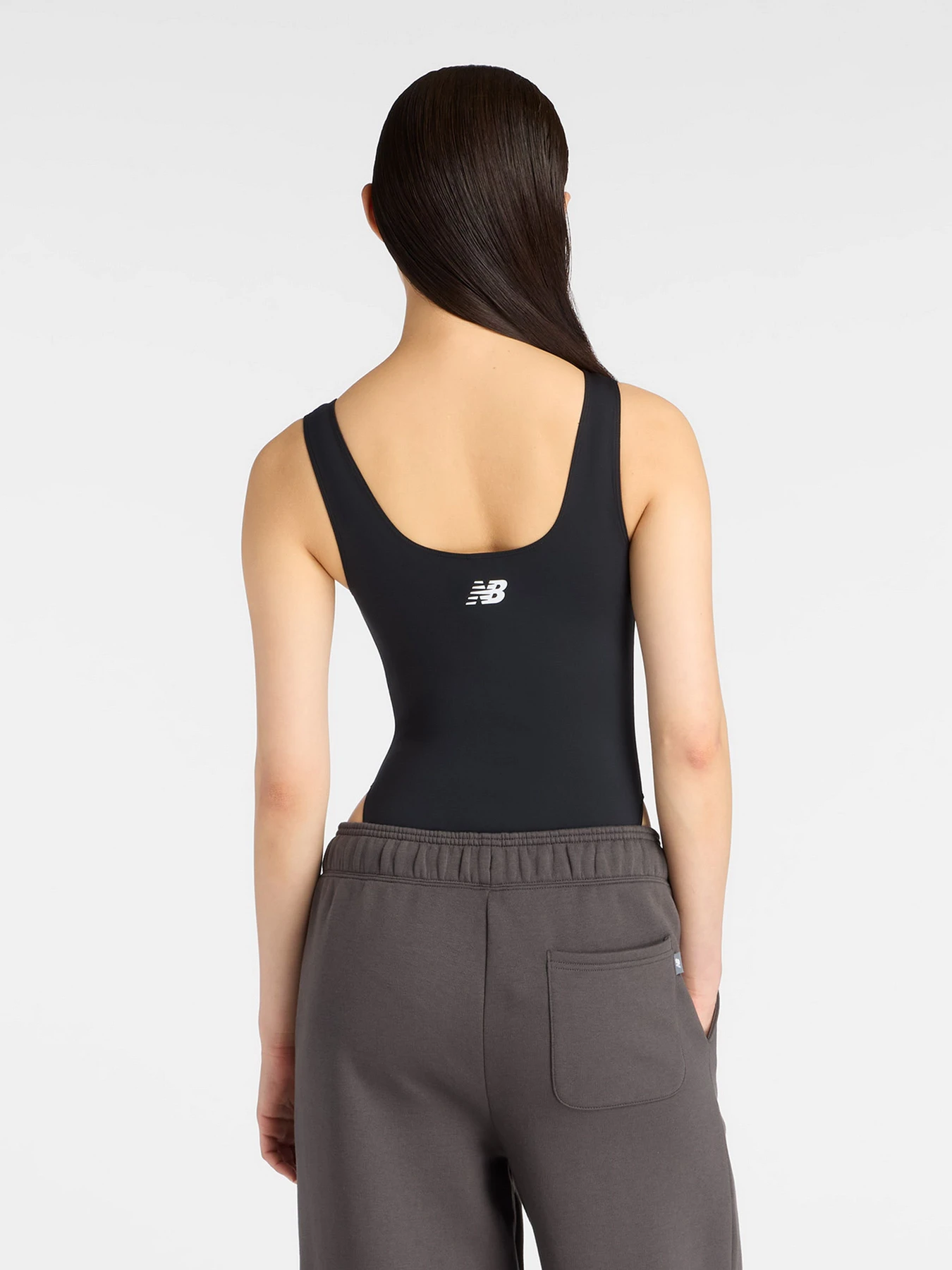 Футболки и поло New Balance Trackside Bodysuit модель WS61T61OBK Футболки и поло New Balance Trackside Bodysuit модель WS61T61OBK Фото