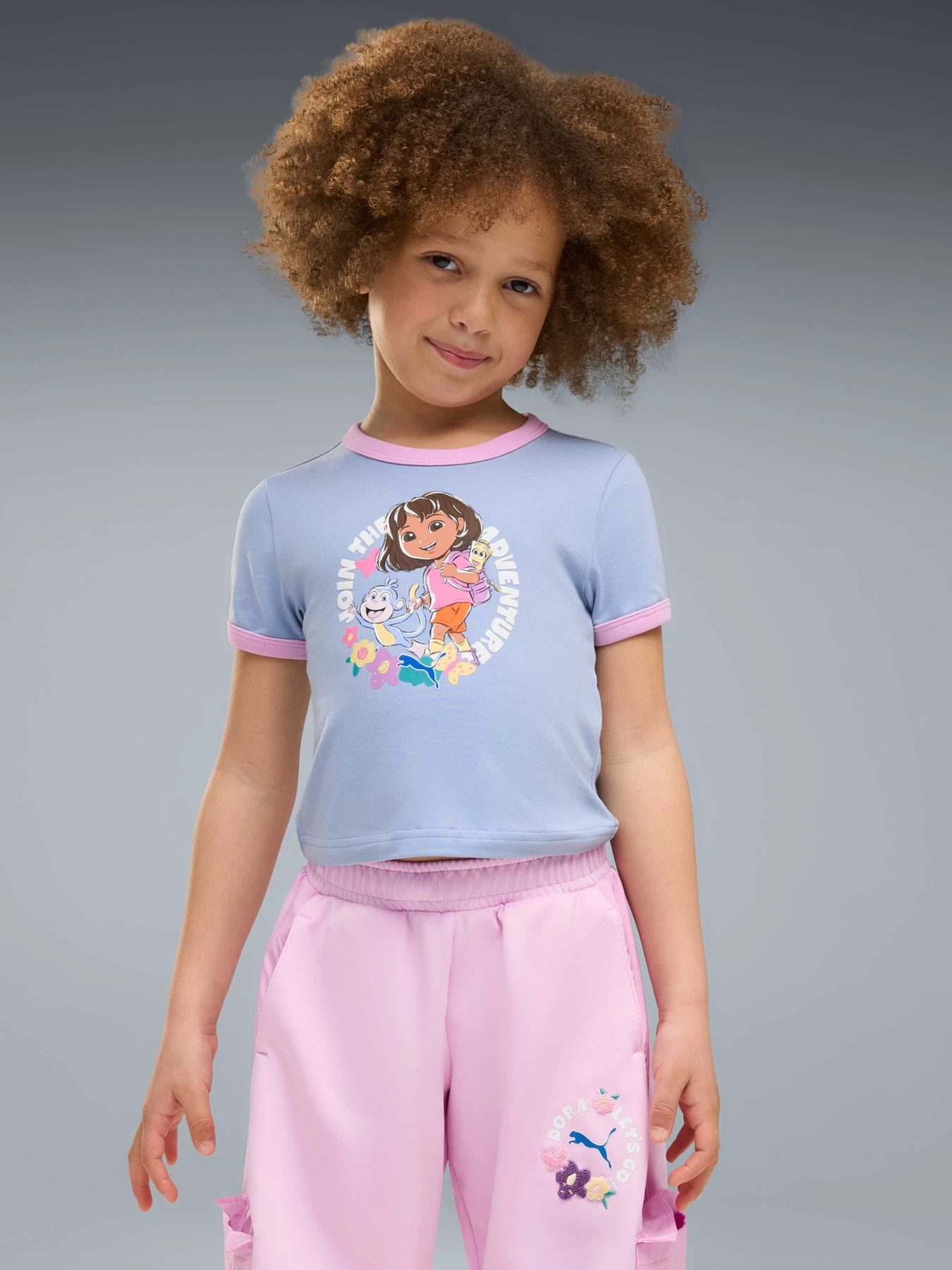 Футболки і поло PUMA x Dora Tee модель 637623 Фото