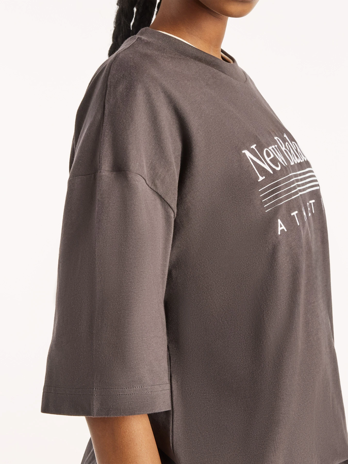 Футболки и поло New Balance Trackside Oversized модель WT6297MKBLK Футболки и поло New Balance Trackside Oversized модель WT6297MKBLK Фото